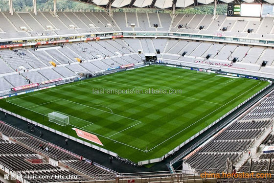 Césped de fútbol de material PP de 15 mm de altura de pelo con 12000 Dtex y revestimiento de PU para campos deportivos exteriores